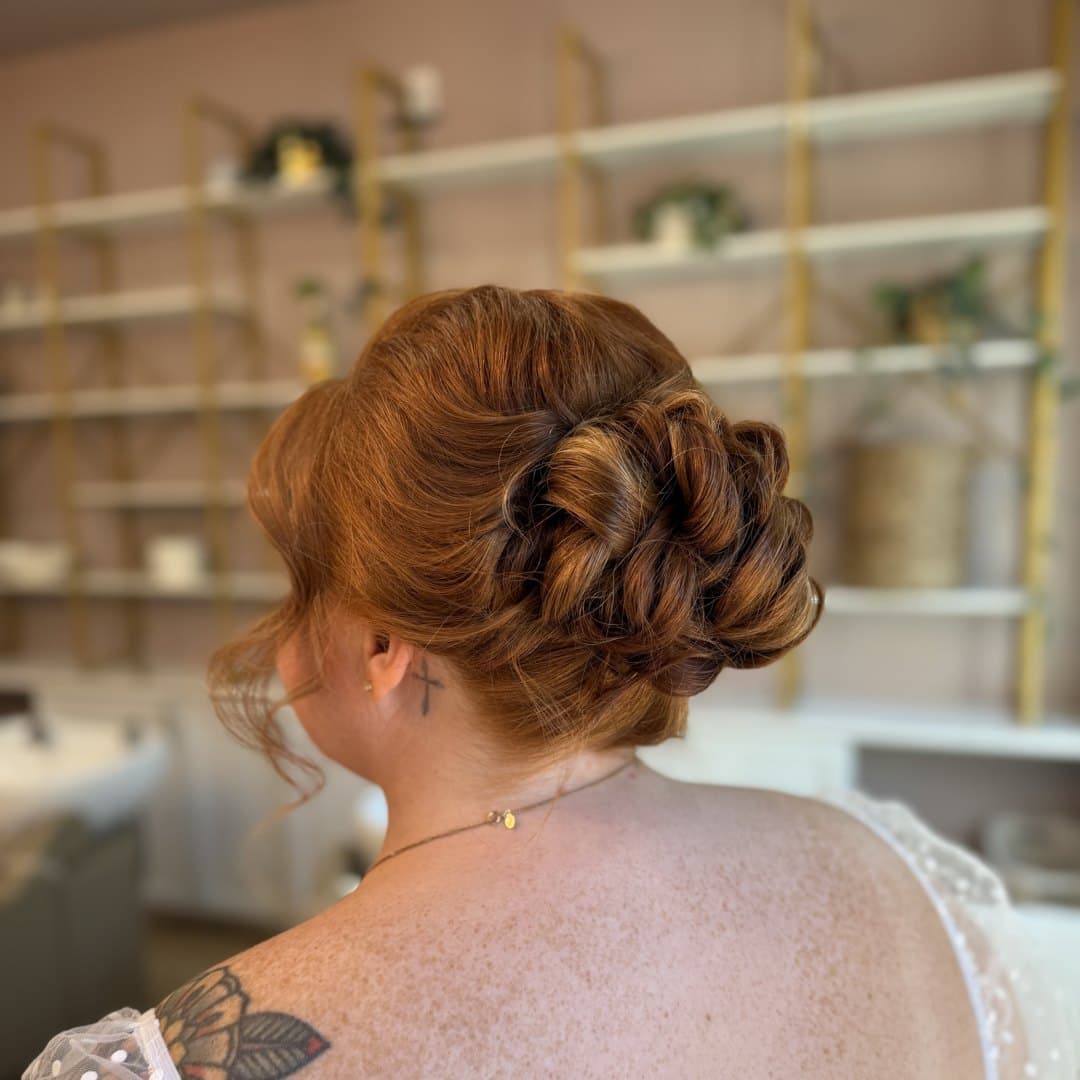 Auburn pinned curls in a soft bridal updo