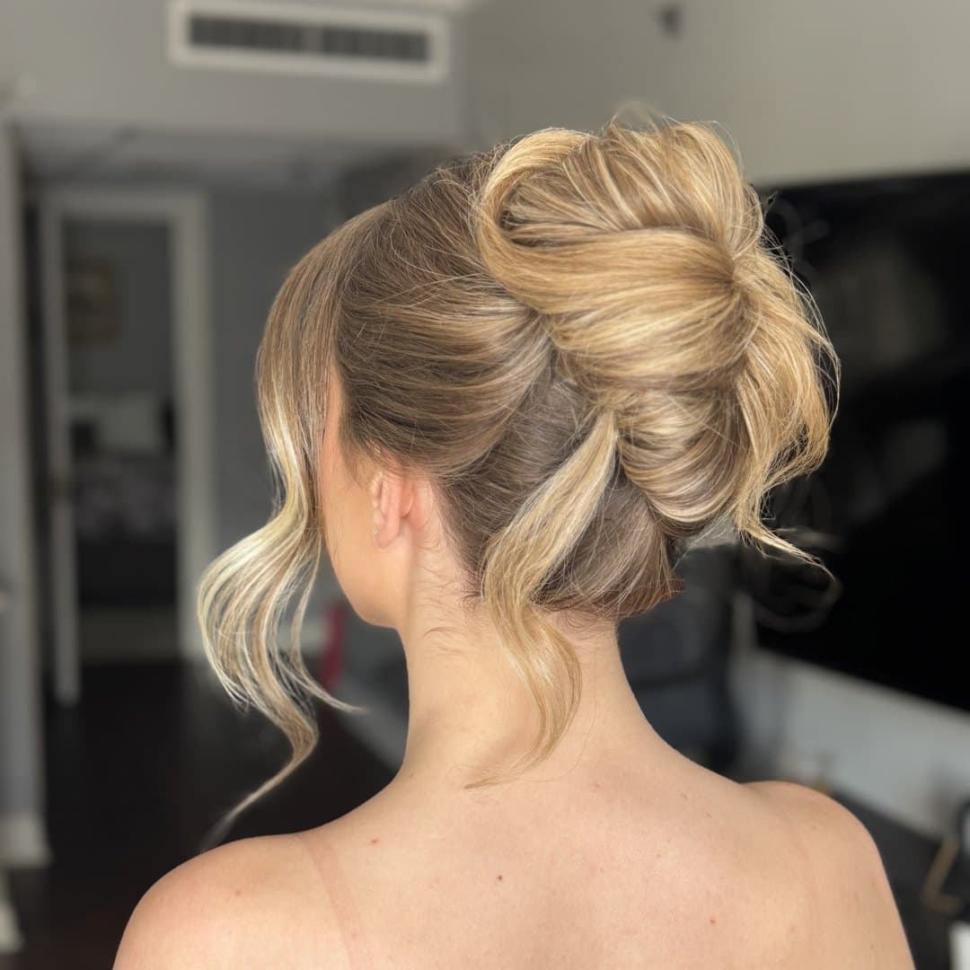 High twisted topknot with curled pieces